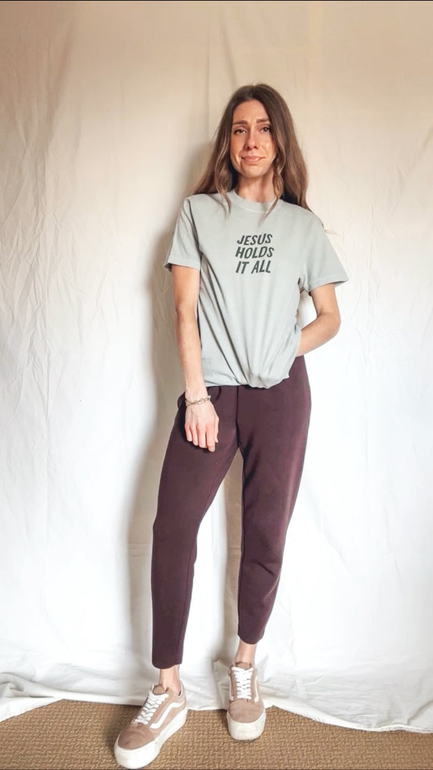 Jesus Holds It All Graphic Tee